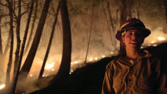 Gracie Bachmann ’23 MF working an active wildland fire at night
