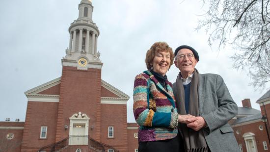Mary Evelyn Tucker and John Grim standing together outside the Yale Divinity School