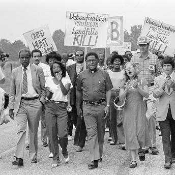Protestors carrying signs in Warren County, North Carolina, 1982