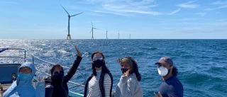 Students on a boat visiting the Block Island offshore wind farm on a field trip
