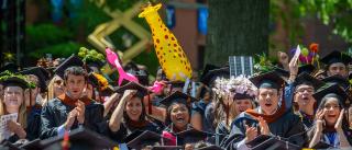 Graduates celebrating the conferring of their degrees