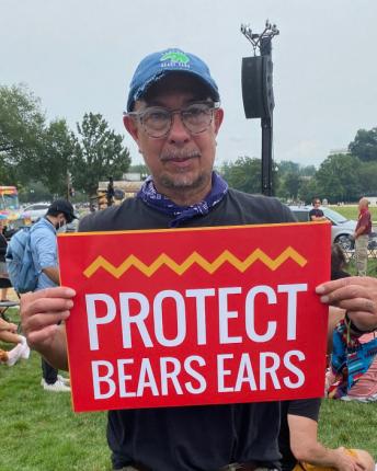 Gonzalez-Rogers holding a sign reading Protect Bears Ears