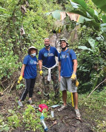 Carlos Velazquez (right) worked to restore trails in El Yunque Rainforest in Luquillo, Puerto Rico, in winter 2020.