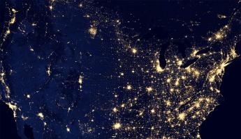 PhD — satellite image of U.S. at night showing illuminated cities