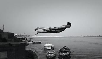 Man photographed mid-air while diving into the Ganga River from the Superhuman River book cover