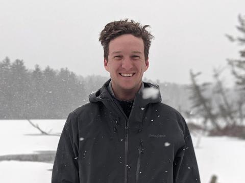 Reid Lewis on a snowy day near a frozen lake