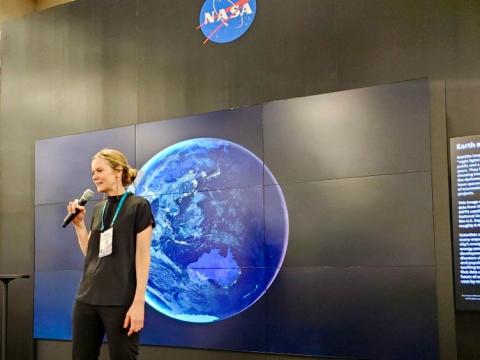 Eleanor Stokes speaking on a NASA stage