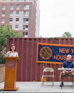 Deneile Cooper speaking at a Housing Authority event in New York City