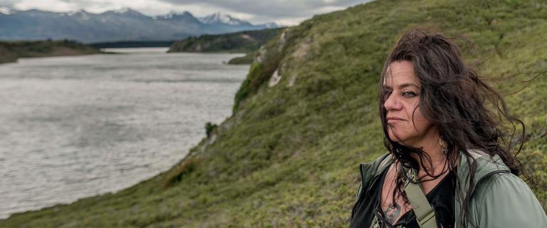  Leticia Caro stands on a bluff in Kawésqar National Park in Patagonia