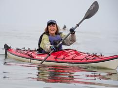 Ann Pesiri Swanson paddling a kayak on Chesapeake Bay