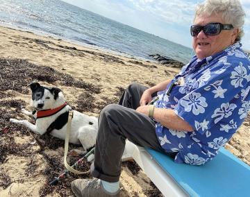 Helen Waldorf and her dog at the beach.