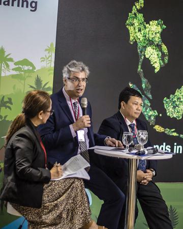 Ganz (center) presenting social forestry trends at the ASEAN-Swiss Partnership on Social Forestry and Climate Change